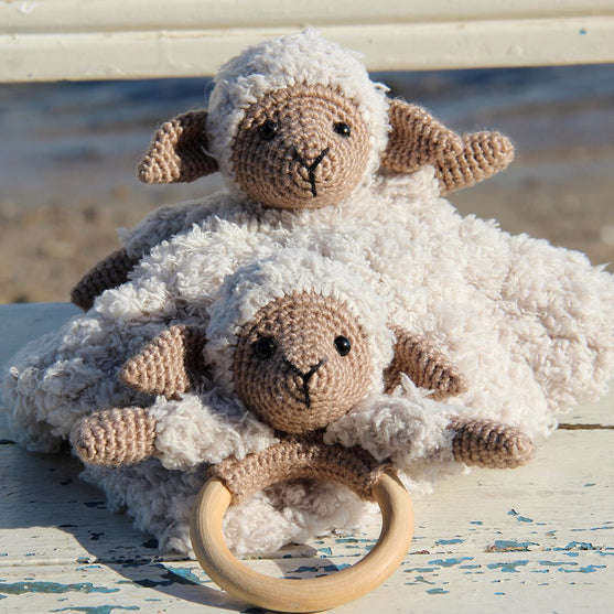 Chanel on cosy blanket and wooden ring
1