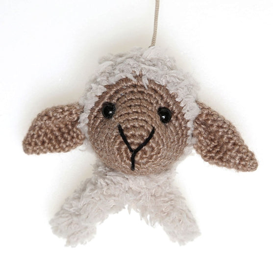 Chanel on cosy blanket and wooden ring
4