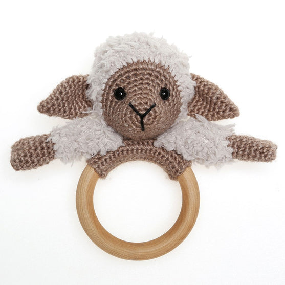 Chanel on cosy blanket and wooden ring
5