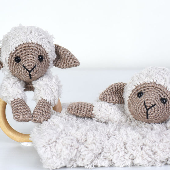 Chanel on cosy blanket and wooden ring
6