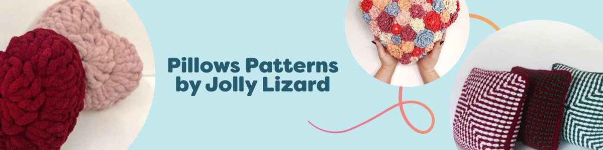 Three crocheted pillows by Jolly Lizard—a heart motif, Love cushion, and cozy Christmas design—arranged on a sofa with Hobbii yarn and a crochet hook.