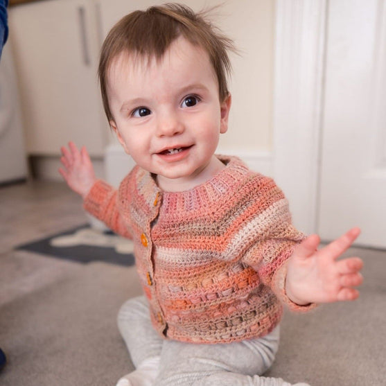

Coral - Children’s Cardigan
2